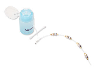 bottle of alcohol, cotton swab, and beaded wire